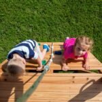 Mount McKinley Wooden Backyard Playset & Swing Set shown in an outdoor setting