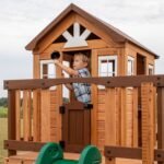 Echo Heights Wooden Kids' Backyard Playhouse shown in an outdoor setting