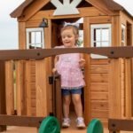 Echo Heights Wooden Kids' Backyard Playhouse shown in an outdoor setting
