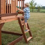 Echo Heights Wooden Kids' Backyard Playhouse shown in an outdoor setting