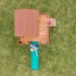Echo Heights Wooden Kids' Backyard Playhouse shown in an outdoor setting