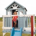 Beacon Heights Kids' Backyard Playhouse shown in an outdoor setting
