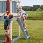 Beacon Heights Kids' Backyard Playhouse shown in an outdoor setting