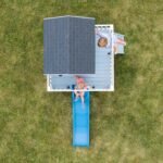 Beacon Heights Kids' Backyard Playhouse shown in an outdoor setting