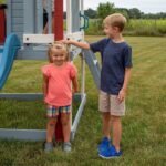 Beacon Heights Kids' Backyard Playhouse shown in an outdoor setting