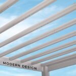 Windham Modern Steel 14 ft. x 10 ft. Pergola with Sail-Shade Canopy shown in an outdoor setting