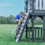 Whispering Point Wooden Backyard Playset & Swing Set shown in an outdoor setting