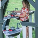 Whispering Point Wooden Backyard Playset & Swing Set shown in an outdoor setting