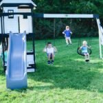 Backyard Discovery Canyon Creek White playset backyard lifestyle view