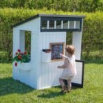 Backyard Discovery Caraway Cottage White playhouse mounted chalkboard