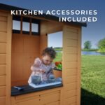 Caraway Cottage Light Brown Wooden Kids' Backyard Playhouse shown in an outdoor setting
