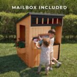Caraway Cottage Light Brown Wooden Kids' Backyard Playhouse shown in an outdoor setting