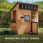 Caraway Cottage Light Brown Wooden Kids' Backyard Playhouse shown in an outdoor setting