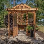 Bellerose 11 ft. x 7 ft. Wood Backyard Greenhouse Kit shown in an outdoor setting