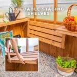 Zalie 12 ft. x 7 ft. Wood Backyard Greenhouse Kit shown in an outdoor setting