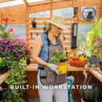 Zalie 12 ft. x 7 ft. Wood Backyard Greenhouse Kit shown in an outdoor setting