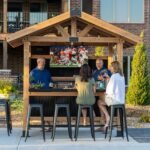 Palisade Wood Patio Bar & Serving Station shown in an outdoor setting