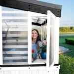 Willow Pre-Stained & Sealed White 9 ft. x 6 ft. Wood Backyard Greenhouse Kit shown in an outdoor setting