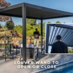 Sarasota 14 ft. x 10 ft. Steel Louvered Patio Pergola shown in an outdoor setting