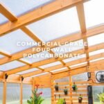 Willow 9 ft. x 6 ft. Wood Backyard Greenhouse Kit shown in an outdoor setting