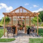 Bellerose XL 13 ft. x 11 ft. Wood Backyard Greenhouse Kit shown in an outdoor setting