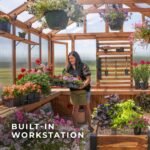 Bellerose XL 13 ft. x 11 ft. Wood Backyard Greenhouse Kit shown in an outdoor setting