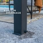 Sarasota 12 ft. x 10 ft. Steel Louvered Patio Pergola shown in an outdoor setting