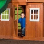 Shenandoah Wooden Backyard Playset & Swing Set shown in an outdoor setting