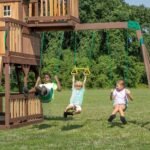 Backyard Discovery Skyfort II wave-slide playset swing beam with belt swings and trapeze