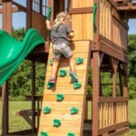 Backyard Discovery Skyfort II wave-slide playset 12-hold rock climbing wall