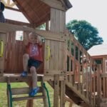 Backyard Discovery Malibu playset rear view with children