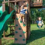 Backyard Discovery Skyfort II tube-slide playset 12-hold rock climbing wall