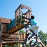 Backyard Discovery Woodridge Elite gray playset ladder and tunnel view